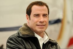 Massören drar tillbaka sexanklagelserna mot John Travolta